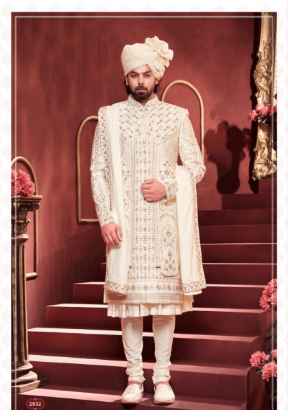 Men’s white sherwani with red and golden embroidery, ideal for wedding and festive occasions from ShubhVivah Showroom